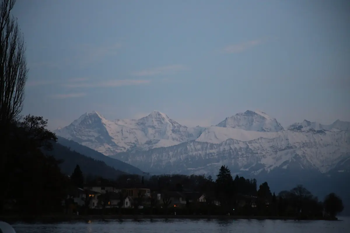 Eiger, Mönch and Jungfrau seen from Lake Thun in the evening