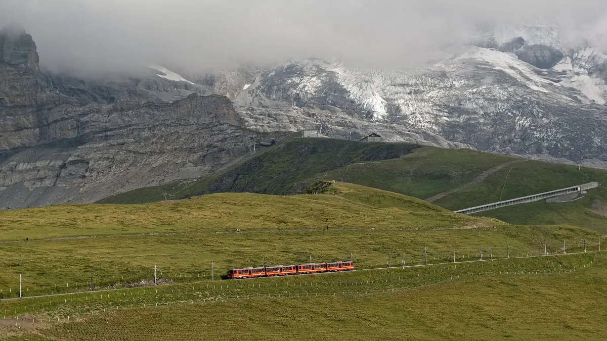 A Jungfrau Railway train on the meadows near Kleine Scheidegg