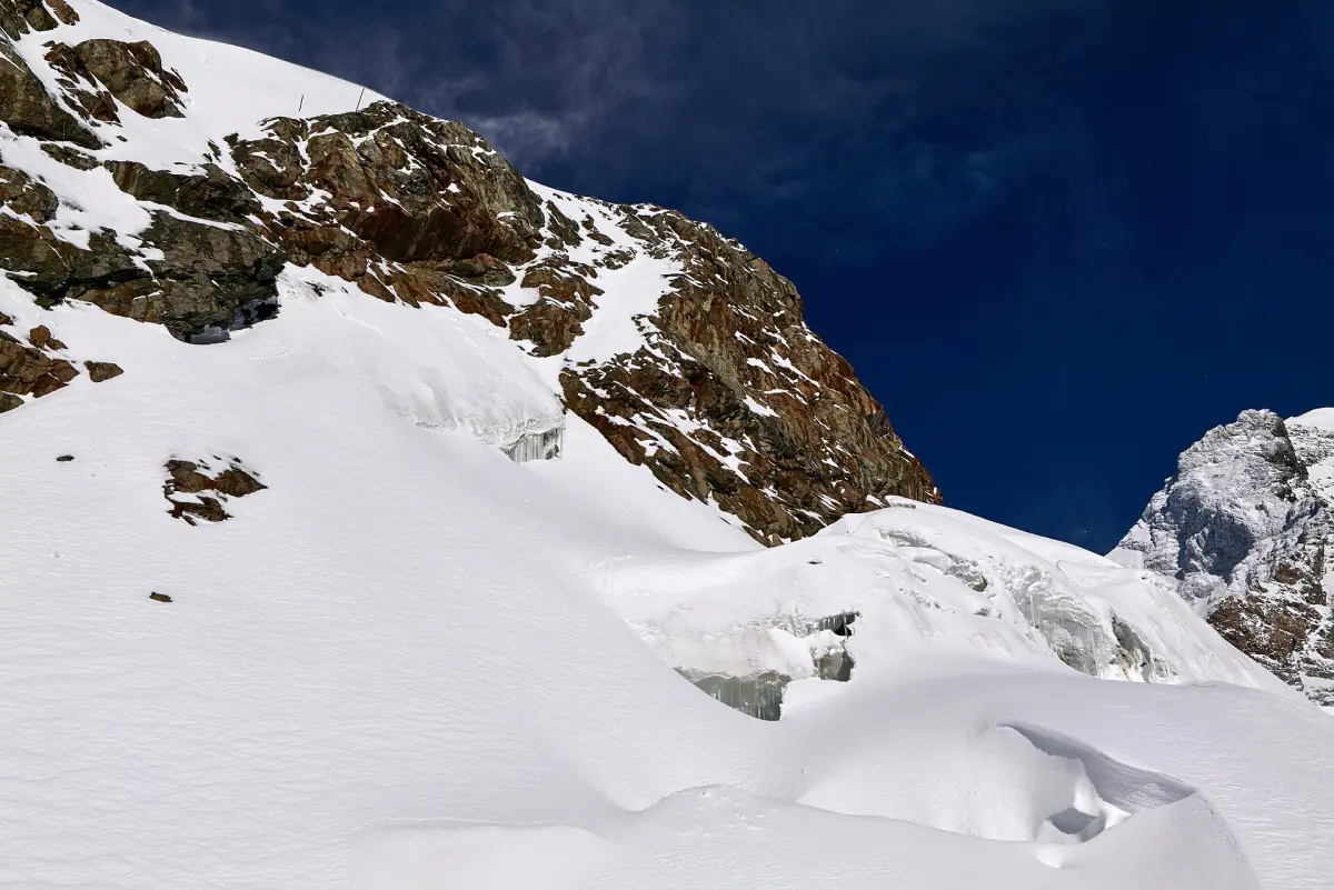 Snowfields and rock at the Jungfraujoch below the Sphinx
